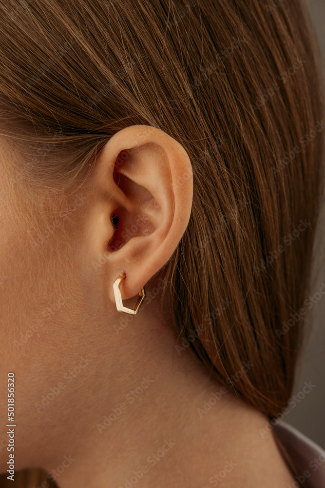 beautiful girl. Fashionable and stylish woman in fashion jewelry big earrings. Fashion appearance, beauty and style. Natural makeup and easy styling beautiful girl. Fashionable and stylish woman in fashion jewelry big earrings. Fashion appearance, beauty and style. Natural makeup and easy styling