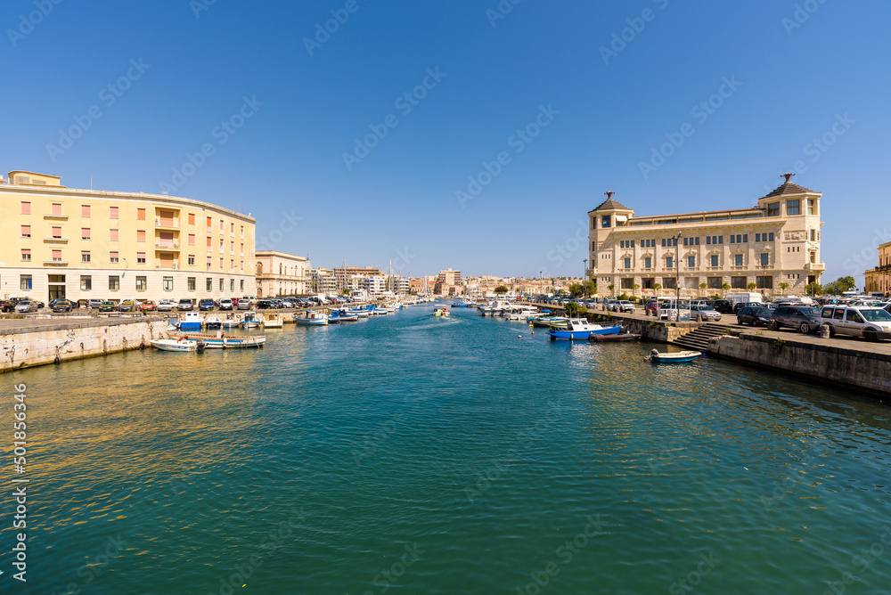 Syracuse, Sicily. View of the strait of water between mainland Siracusa and the island of Ortigia. They are linked by the Umbertino Bridge and the Santa Lucia Bridge.