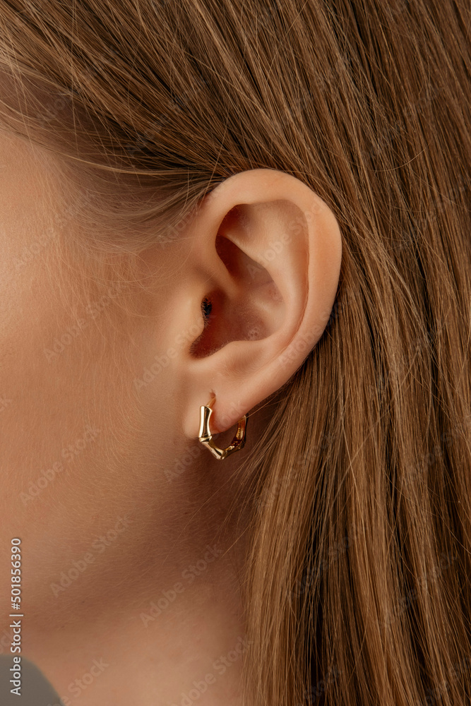 beautiful girl. Fashionable and stylish woman in fashion jewelry big earrings. Fashion appearance, beauty and style. Natural makeup and easy styling beautiful girl. Fashionable and stylish woman in fashion jewelry big earrings. Fashion appearance, beauty and style. Natural makeup and easy styling
