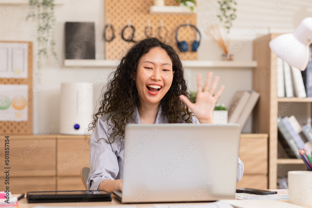 Long Curly hair woman doing online video chat call record vlog blog talking to camera looking at webcam indoors at home office, video call and social media concept. Long Curly hair woman doing online video chat call record vlog blog talking to camera looking at webcam indoors at home office, video call and social media concept.