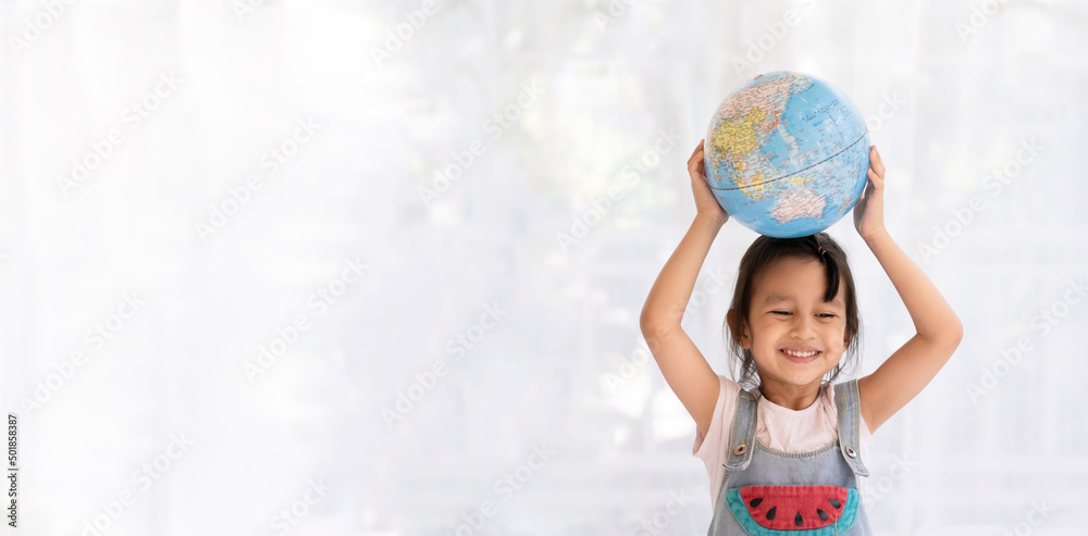 Banner of happy aasian little girl is raising the globe model with love and concept of preserve, save and protect the earth from environment problem and global warming, kid education at home. Banner of happy aasian little girl is raising the globe model with love and concept of preserve, save and protect the earth from environment problem and global warming, kid education at home.
