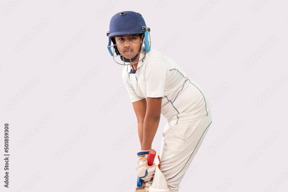 Portrait of boy getting ready to strike During a Cricket Game Portrait of boy getting ready to strike During a Cricket Game
