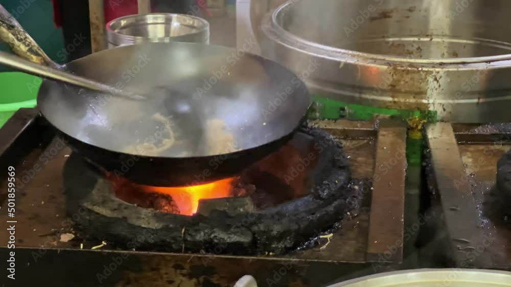 A chef in Nanning, Guangxi, China cooks snacks called Laoyoufen, sour bamboo shoots and pork rice noodles A chef in Nanning, Guangxi, China cooks snacks called Laoyoufen, sour bamboo shoots and pork rice noodles