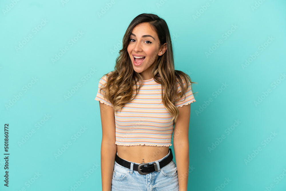 Young woman over isolated blue background with surprise facial expression Young woman over isolated blue background with surprise facial expression