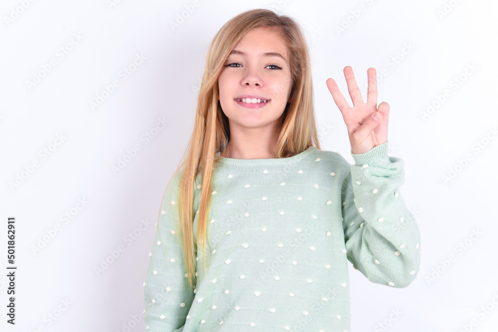 little caucasian kid girl wearing fashion sweater over blue background showing and pointing up with fingers number three while smiling confident and happy. little caucasian kid girl wearing fashion sweater over blue background showing and pointing up with fingers number three while smiling confident and happy.