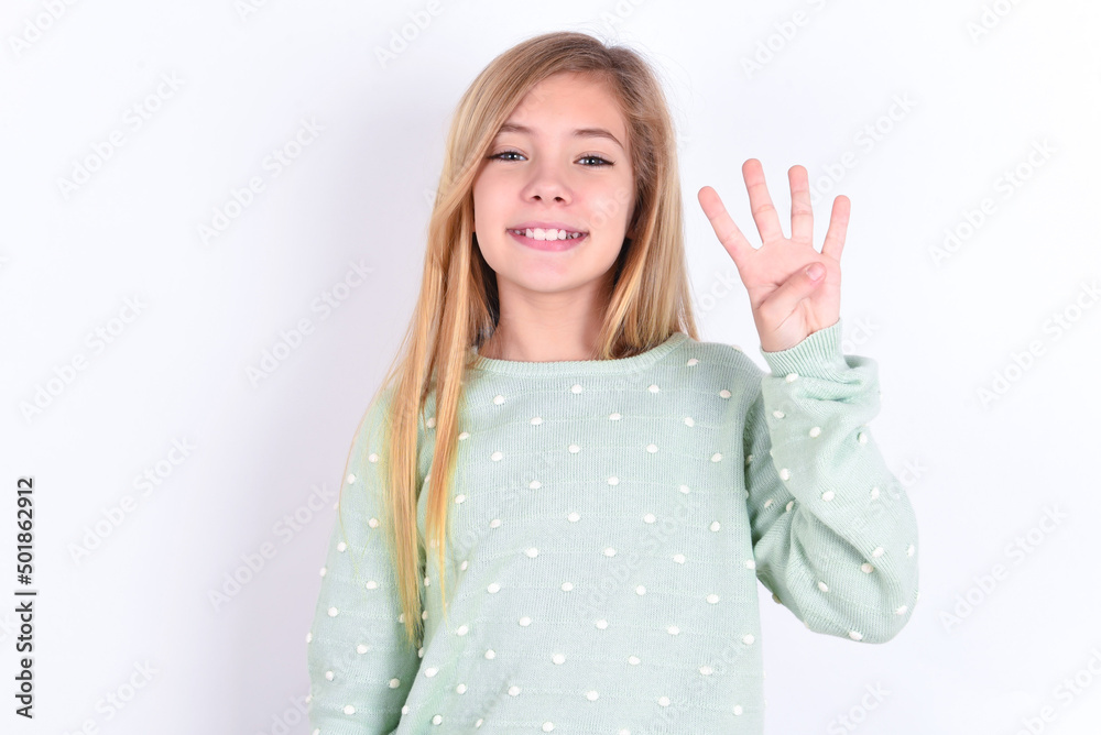 little caucasian kid girl wearing fashion sweater over blue background showing and pointing up with fingers number four while smiling confident and happy. little caucasian kid girl wearing fashion sweater over blue background showing and pointing up with fingers number four while smiling confident and happy.