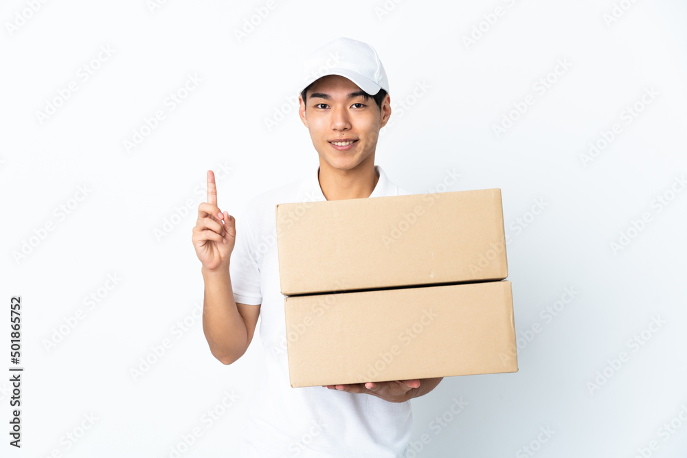 Delivery Chinese man isolated on white background pointing up a great idea Delivery Chinese man isolated on white background pointing up a great idea