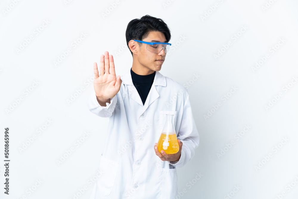 Young Chinese scientific man isolated on white background making stop gesture and disappointed Young Chinese scientific man isolated on white background making stop gesture and disappointed