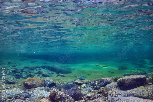 ocean underwater rays of light background  under blue water sunlight