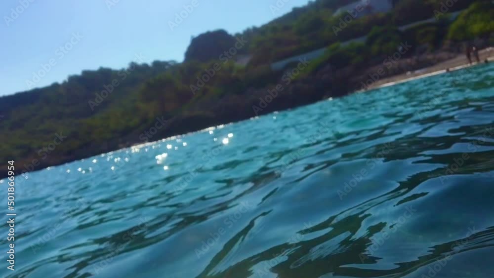 slow-motion blurring of seawater with splash and light glare of the sun, ends under water. blurred image footage slow-motion blurring of seawater with splash and light glare of the sun, ends under water. blurred image footage