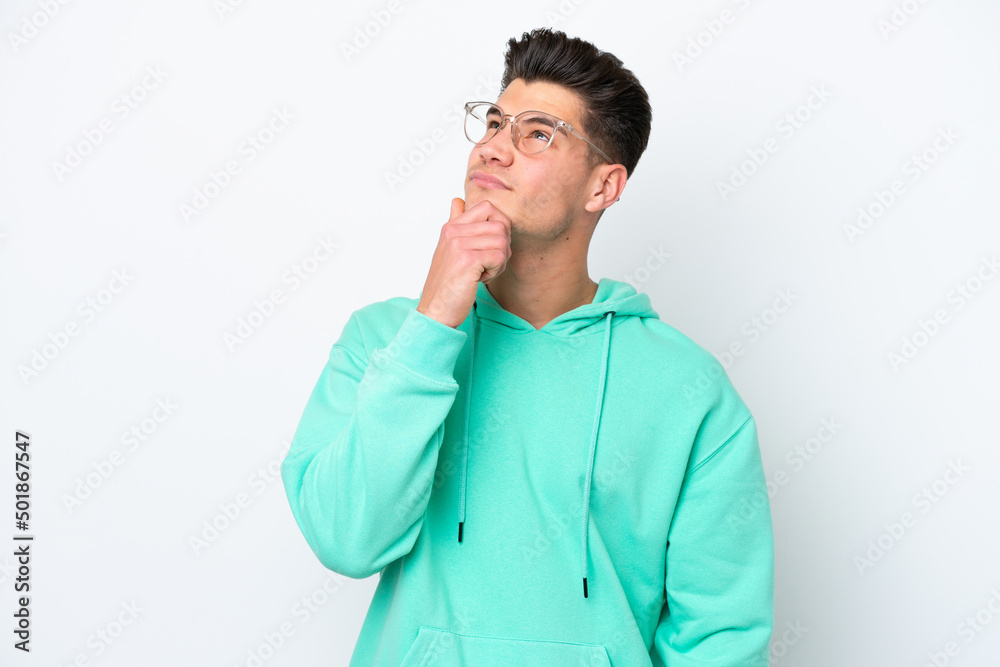 Young handsome caucasian man isolated on white bakcground having doubts Young handsome caucasian man isolated on white bakcground having doubts