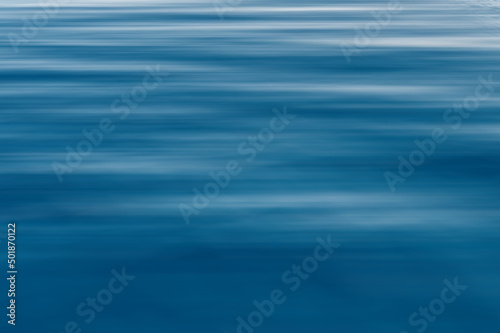 Soft blurred sea surface. Blue water texture. Close up blue water surface at deep ocean