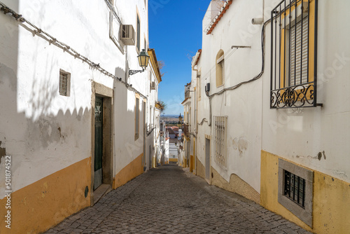 Street in the old town of the fortified city of Elvas (World Heritage Site by UNESCO) with its traditional white facades. Alentejo region, Portugal. © JoseLuis
