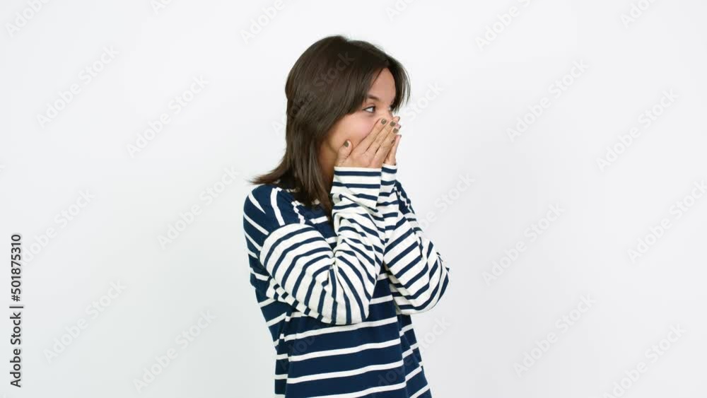 Young brunette woman covering mouth with hands. Can not speak over isolated background Young brunette woman covering mouth with hands. Can not speak over isolated background