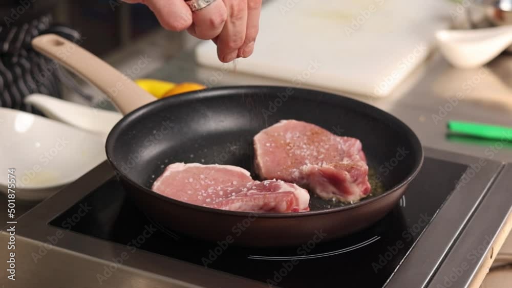 Chef frying meat in a pan
