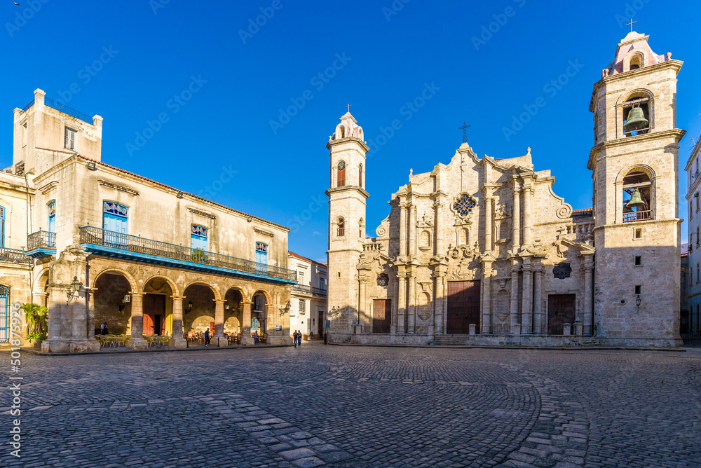 View of the Square of the Cathedral of the Virgin Mary in Havana, Cuba (Plaza de La Catedral de la Virgen María de la Concepción Inmaculada de La Habana in Spanish), on a sunny morning.