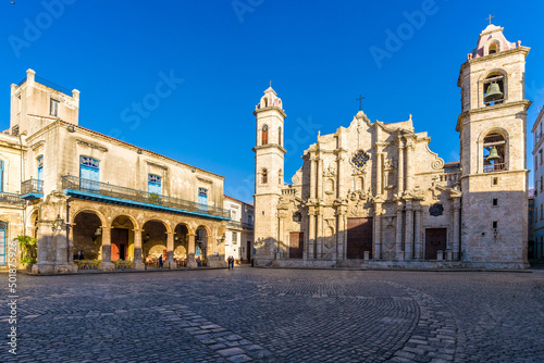View of the Square of the Cathedral of the Virgin Mary in Havana, Cuba (Plaza de La Catedral de la Virgen María de la Concepción Inmaculada de La Habana in Spanish), on a sunny morning.
