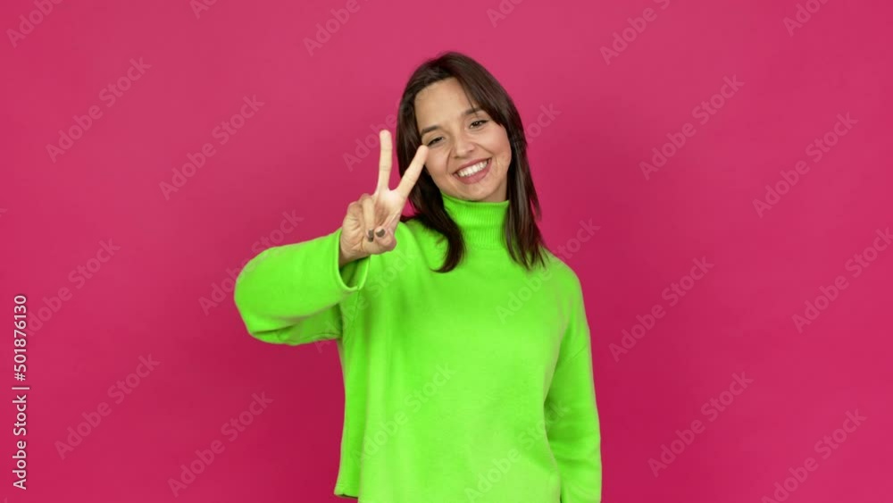 Young brunette woman happy and counting with fingers over isolated background