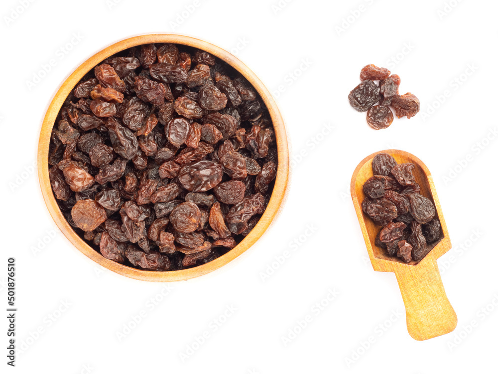 Raisin in brown wooden bowl, scoop, bunch, isolated on white background Raisin in brown wooden bowl, scoop, bunch, isolated on white background