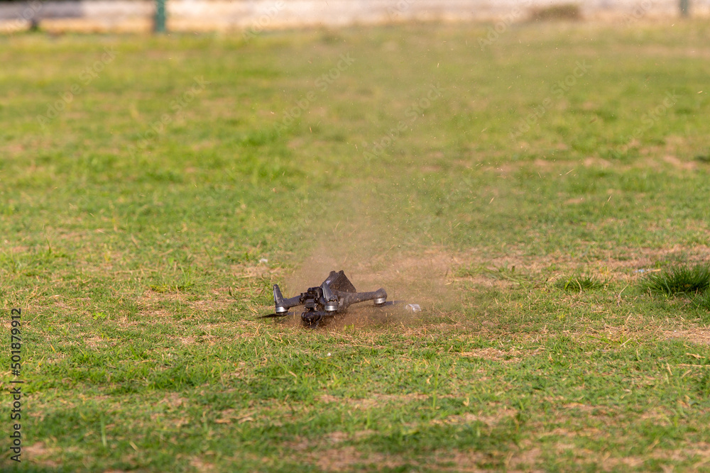 Fototapeta premium Drone crashing into the ground during flight. BLURRY