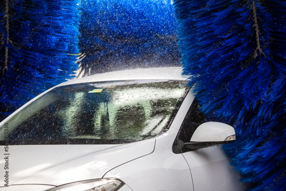 Washing the car in an automatic washing machine. Brushed Car Washing
