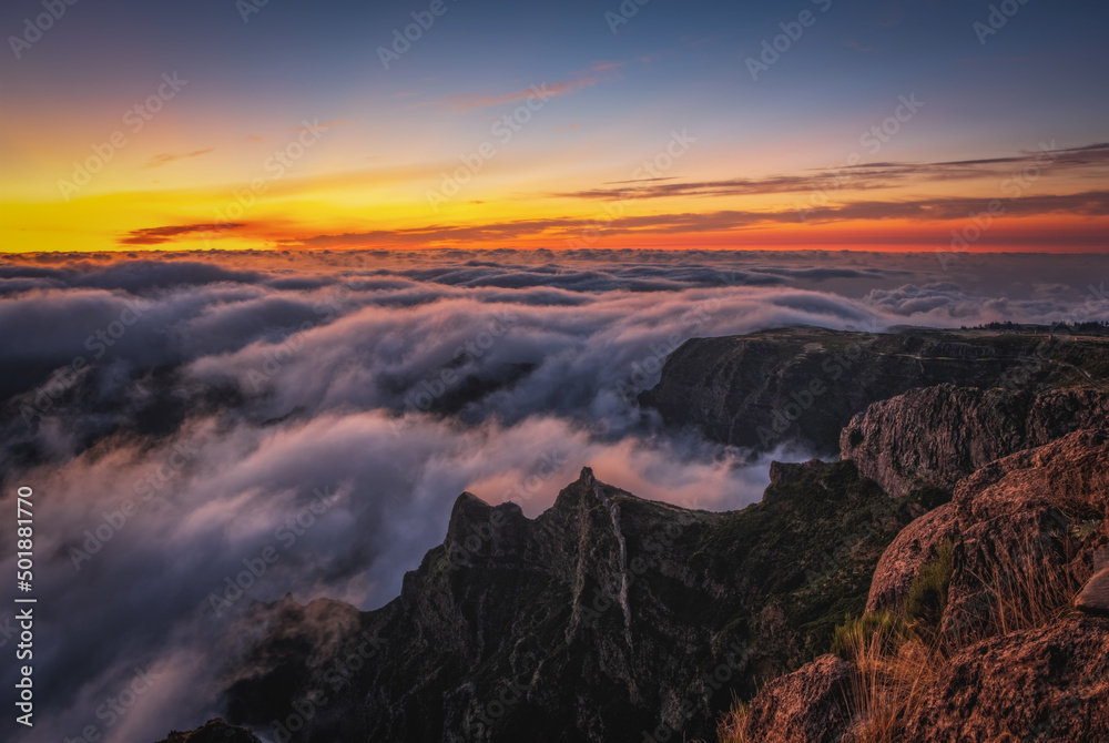 Mountain trail Pico do Arieiro, Madeira Island, Portugal Scenic view of steep and beautiful mountains and clouds during sunrise. October 2021. Long exposure picture