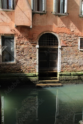 Italy, Veneto, Venice: Old door on the Canal. © Raffaello Tiziano