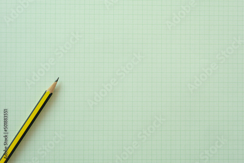 close up pencil on graph paper background, education concept