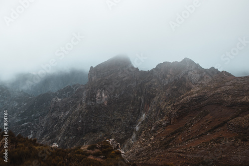 Views of the island of Madeira from the high mountain, Pico Arieiro. Adventure on a small island in the Atlantic Ocean. Green vegetation turning into a rocky surface. Portugal treasure