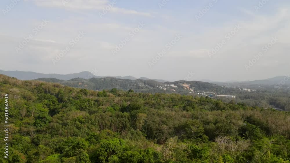 4K aerial front view. Jungle of Banana Beach, Phuket, beach, sea, sand and palm trees. Drone view of beautiful tropical white sand beach on a hot summer day. Top view 4K aerial front view. Jungle of Banana Beach, Phuket, beach, sea, sand and palm trees. Drone view of beautiful tropical white sand beach on a hot summer day. Top view