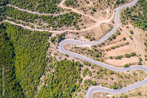 Meandering serpentine road in the mountain. Aerial view. Copter, drone view