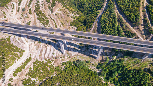 Aerial view on highway bridge in the mountain. Drone, copter view.