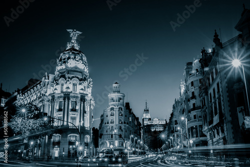 Rays of traffic lights on Gran via street, main shopping street in Madrid at night. Spain, Europe photo