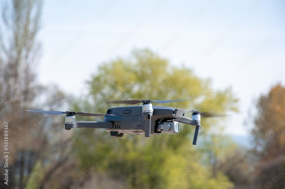 Shot of gray drone in flight.