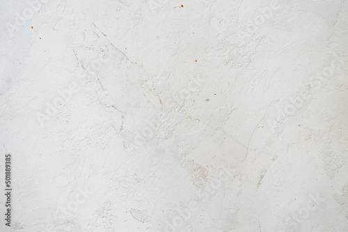 artistic plaster on a gray and white wall. Repairs. elements of wall decor. copy space. texture. background. © Maria