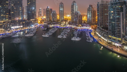 Luxury yacht bay in the city aerial night to day timelapse in Dubai marina