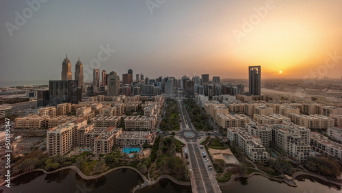Panorama of skyscrapers in Barsha Heights district and low rise buildings in Greens district aerial all day timelapse.