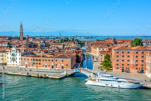 Panoramic view of Waterfront Riva Sant Biasio Brigde with Tourists Motor yacht Trident moored outside the Museo Storico Navale (naval history museum) in Venice, Italy