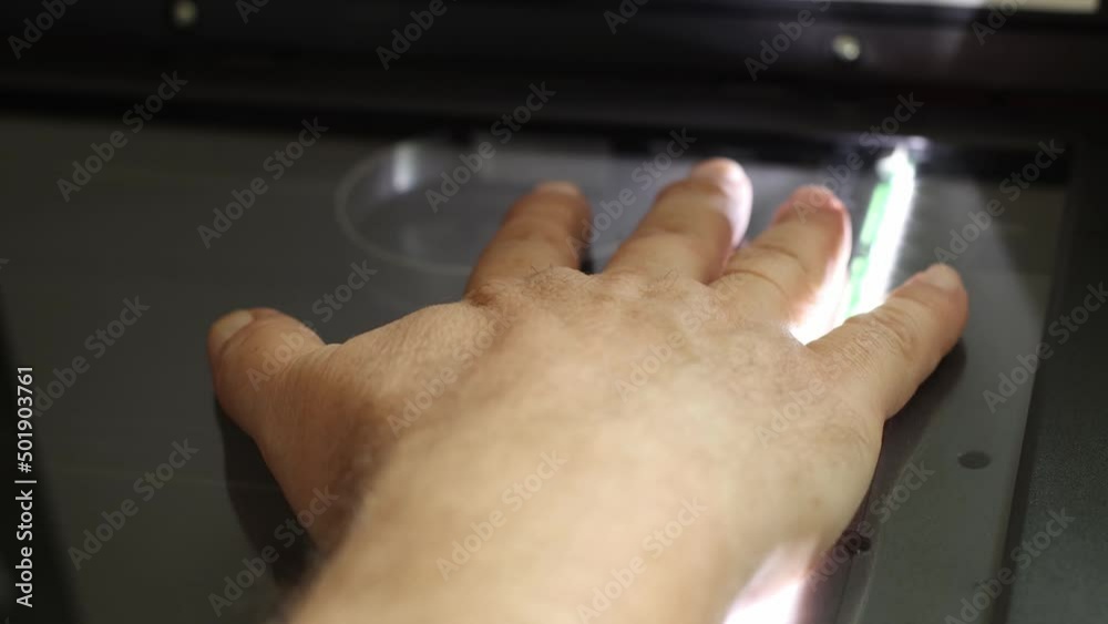 Human right handprint scanning, biometric data collection, close-up, security and information protection concept Human right handprint scanning, biometric data collection, close-up, security and information protection concept