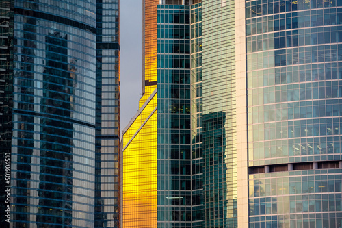 Moscow city glass skyscrapers at sunset, close up view