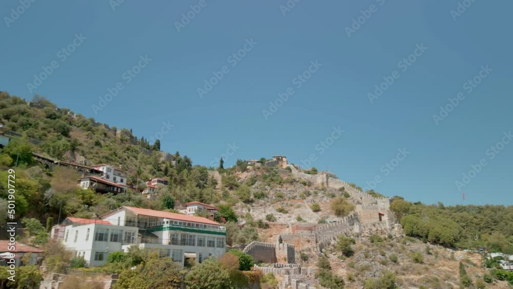 Houses on a hill in the historical part of the old city in Alanya. View from the drone. Houses on a hill in the historical part of the old city in Alanya. View from the drone.