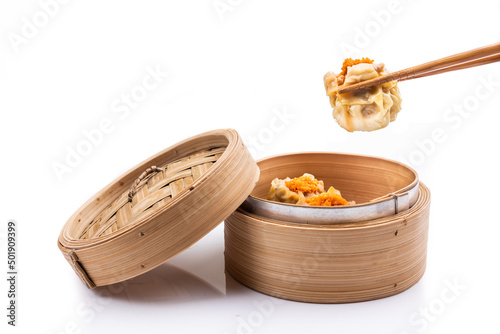 Freshly steamed siew mai or shaomai is poular Cantonese Chinese dim sum delicacy photo