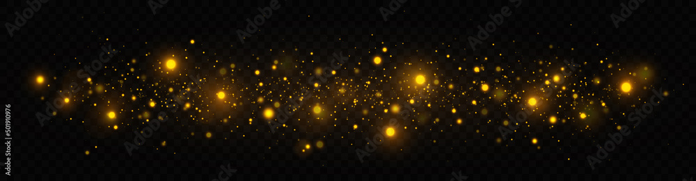 Golden shimmering background with light effect. The dust sparks and golden stars shine with special light on a transparent background. Christmas concept.