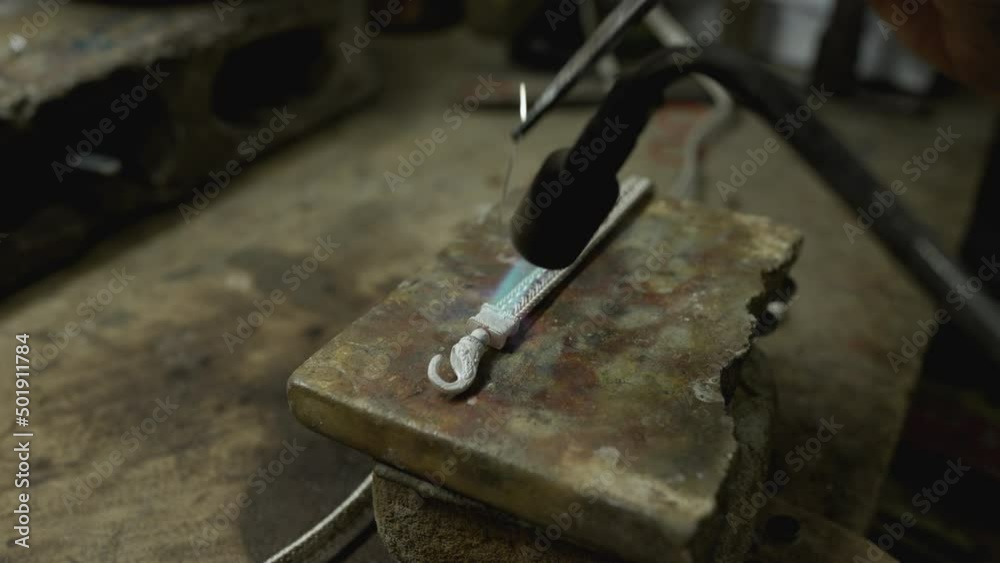 Jeweler at work in jewelry. Desktop for craft jewelry making with professional tools. Close up view of tools. Thailand. Jeweler at work in jewelry. Desktop for craft jewelry making with professional tools. Close up view of tools. Thailand.