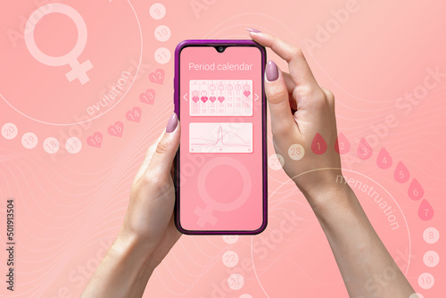 Menstrual cycle tracker mobile app on the smartphone screen in the hands of a woman. Modern technologies for tracking women's health, pregnancy planning photo