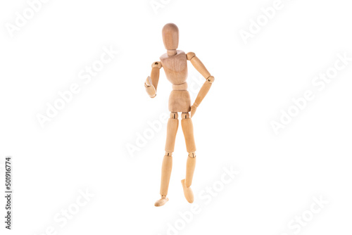 a wooden man stands with one hand at the belt with the other pointing forward isolated on a white background