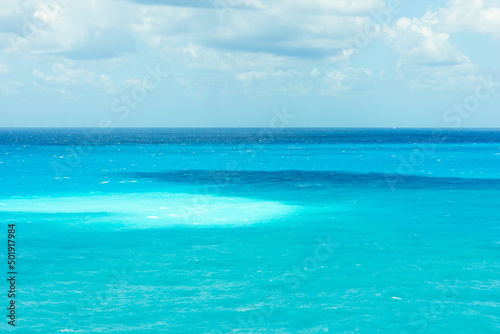  Turquoise water background. Ionic blue sea. © patruflo