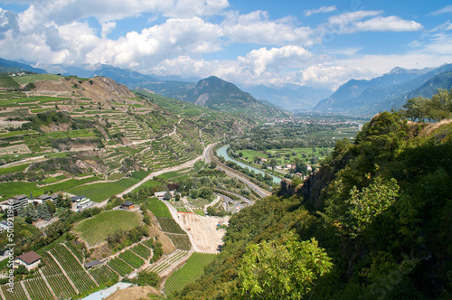 Panorama of the Alpine mountain range with the city of Sion in the valley