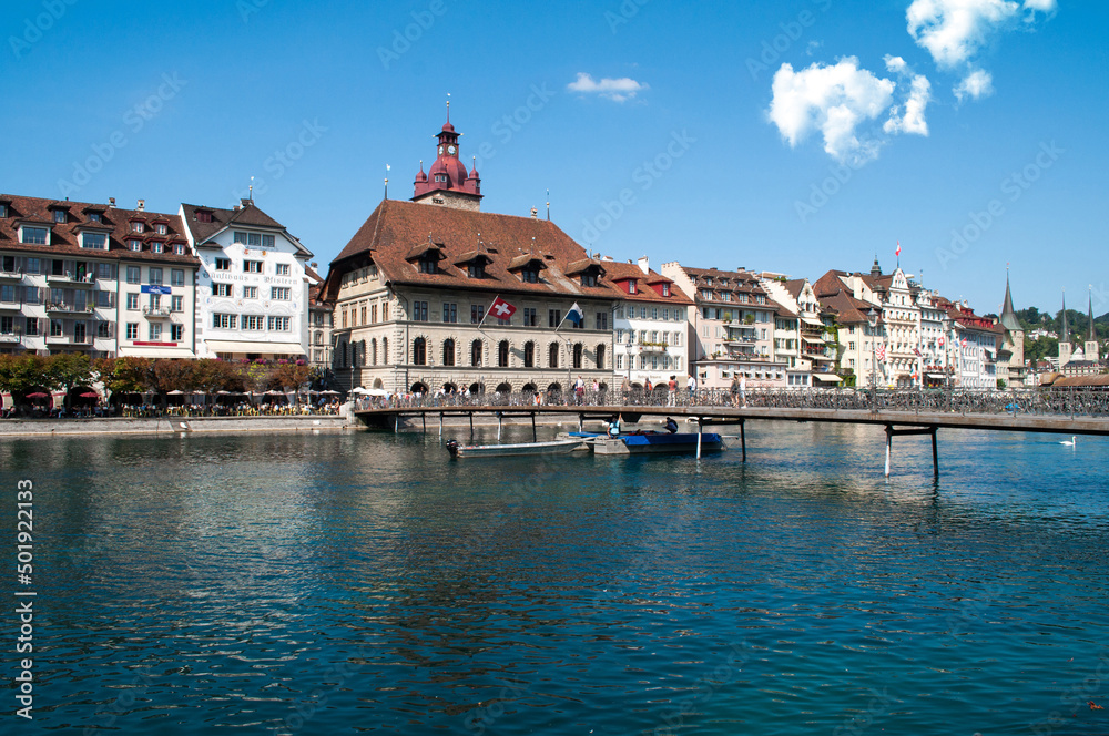 Lucerne, Switzerland - old wooden bridge and buildings on the lake embankment