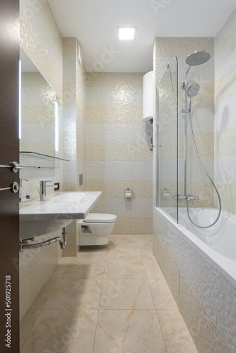 bathroom with bath and shower in beige tiles  modern bathroom  bathroom with mosaic beige tiles